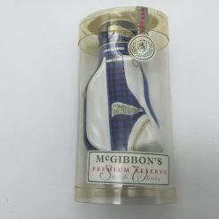 Sac De Golf ' Elliot Bag' En Céramique De 11 Cm De Haut Rempli De 50 Ml 43% Scotch Whisky De Mc Gibbon's, Couleur Bleu Et Tartan, Pour Le Collectionneur Et/ou Amateur De Whisky